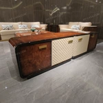 Refined TV Stand with Quilted Upholstered Panels, Natural Wood Veneer Finish and Brushed Stainless Steel Handles